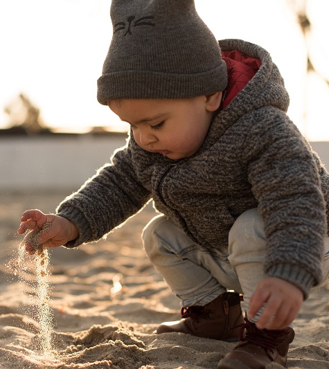 Boy playing in sand